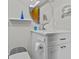 Well-lit bathroom featuring modern fixtures, a round mirror, and a white vanity at 2240 Pinewood Villas Dr, Holiday, FL 34691