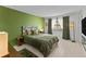 Bright bedroom featuring a colorful headboard, sleek flooring, and minimalist decor at 2240 Pinewood Villas Dr, Holiday, FL 34691