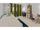Bedroom featuring a desk, work space, comfortable sleeping space, and outdoor access at 2240 Pinewood Villas Dr, Holiday, FL 34691
