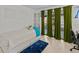 Modern bedroom with closet, desk, and doors leading to an outdoor patio at 2240 Pinewood Villas Dr, Holiday, FL 34691