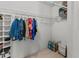 Walk-in closet with wire shelving for ample storage of clothes, shoes, and personal items at 2240 Pinewood Villas Dr, Holiday, FL 34691