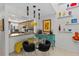 Bright dining area open to the kitchen features modern decor and adjacent shelving at 2240 Pinewood Villas Dr, Holiday, FL 34691