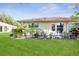 Beautiful backyard with a well maintained lawn and a paver patio at 2460 Northside Dr # 708, Clearwater, FL 33761