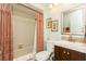 Bathroom with shower, vanity, toilet, and framed art at 2460 Northside Dr # 708, Clearwater, FL 33761