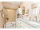 Bathroom featuring a double sink vanity with granite countertop and a tiled walk-in shower at 2460 Northside Dr # 708, Clearwater, FL 33761
