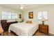 Bright bedroom features hard wood floors and ample natural light from two large windows at 2460 Northside Dr # 708, Clearwater, FL 33761