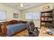 Bedroom with daybed, bookshelf, window, and desk at 2460 Northside Dr # 708, Clearwater, FL 33761