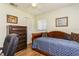 Bedroom with daybed, dresser, and window at 2460 Northside Dr # 708, Clearwater, FL 33761
