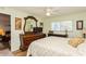 Comfortable bedroom showing a ceiling fan, window, dresser, and mirror at 2460 Northside Dr # 708, Clearwater, FL 33761