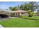 Well-maintained condo with lush lawn and covered parking, creating an inviting exterior at 2460 Northside Dr # 708, Clearwater, FL 33761