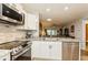 Modern kitchen featuring stainless steel appliances, granite countertops, and an open view to the living area at 2460 Northside Dr # 708, Clearwater, FL 33761
