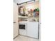 The laundry area boasts a full-sized washer, dryer, and plenty of shelving at 2460 Northside Dr # 708, Clearwater, FL 33761