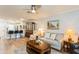 Bright living room with hardwood floors, china cabinet, and view of kitchen at 2460 Northside Dr # 708, Clearwater, FL 33761