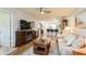 Bright living room showcasing hard floors, an entertainment center, and comfortable seating at 2460 Northside Dr # 708, Clearwater, FL 33761