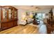 Living room with hardwood floors, neutral furniture, and a decorative hutch at 2460 Northside Dr # 708, Clearwater, FL 33761