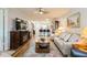 Inviting living room featuring a decorative rug, fireplace, and open access to the dining area at 2460 Northside Dr # 708, Clearwater, FL 33761