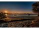Picturesque beach with a waterfront sunset view and calm waters at 2700 Bayshore Blvd # 1206, Dunedin, FL 34698