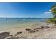 A tranquil beach setting shows clear waters perfect for a refreshing swim at 2700 Bayshore Blvd # 1206, Dunedin, FL 34698