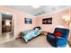 Bright bedroom features a comfortable twin bed, chair, and a serene ambiance at 2700 Bayshore Blvd # 1206, Dunedin, FL 34698