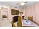 Dining area features a round table, access to hall, and storage cabinets at 2700 Bayshore Blvd # 1206, Dunedin, FL 34698