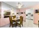 A quaint dining area with pink walls, mirrored wall, and tiled floors at 2700 Bayshore Blvd # 1206, Dunedin, FL 34698