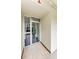 Building entrance with glass doors leading to the second floor, featuring a clean and modern design at 2700 Bayshore Blvd # 1206, Dunedin, FL 34698