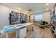 Community library offering bookshelves, a desk with chairs, and wood-look floors at 2700 Bayshore Blvd # 1206, Dunedin, FL 34698