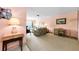 Bright living room with comfortable seating, neutral carpet, and a view to the outside at 2700 Bayshore Blvd # 1206, Dunedin, FL 34698
