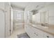 Bright bathroom features double sinks, soaking tub, and tiled floors at 27826 Sora Blvd, Wesley Chapel, FL 33544