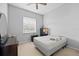 Clean bedroom with window, neutral colors and flooring, and minimal furnishings at 27826 Sora Blvd, Wesley Chapel, FL 33544