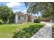 Charming home with a green lawn, mature landscaping, and a well-maintained exterior at 27826 Sora Blvd, Wesley Chapel, FL 33544