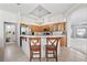 Kitchen with breakfast bar features stainless steel appliances and a view into the Gathering room at 27826 Sora Blvd, Wesley Chapel, FL 33544