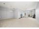 A bright living room with neutral colors, offering a versatile space for relaxation and entertainment at 27826 Sora Blvd, Wesley Chapel, FL 33544