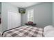 Bedroom with a metal frame bed, a closet, and a piano keyboard at 3037 Riders Pass, Odessa, FL 33556