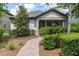 Charming single-story home with lush landscaping and a brick walkway leading to the front door at 3037 Riders Pass, Odessa, FL 33556