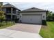 Detached two-car garage with brick-paved driveway at 3037 Riders Pass, Odessa, FL 33556
