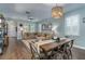 Open living space with wood floors, ceiling fan, and lots of natural light at 3037 Riders Pass, Odessa, FL 33556