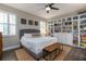 Spacious main bedroom with natural light, shelving, and room for books and games at 3037 Riders Pass, Odessa, FL 33556