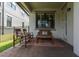 Covered patio with brick flooring and comfortable seating area at 3037 Riders Pass, Odessa, FL 33556
