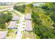 Aerial view of townhouses nestled amongst greenery, showcasing well-maintained properties and surrounding landscape at 30798 Veridian Way, Wesley Chapel, FL 33543