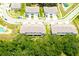 New townhomes with garages, landscaping, and driveways, providing convenient and modern community living at 30798 Veridian Way, Wesley Chapel, FL 33543