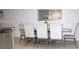 Elegant dining room featuring a formal dining table set for six and tiled floors at 30798 Veridian Way, Wesley Chapel, FL 33543