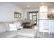 Bright open living space with dining table, sliding glass door and a modern kitchen at 30798 Veridian Way, Wesley Chapel, FL 33543