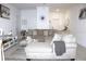 Open-concept living area with sectional sofa, decorative rug, and neutral color palette at 30798 Veridian Way, Wesley Chapel, FL 33543