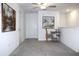 Upstairs loft area featuring neutral carpet, fan, and lots of natural light at 30798 Veridian Way, Wesley Chapel, FL 33543
