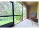 Relaxing screened-in patio with seating, perfect for enjoying the outdoors in comfort and style at 30798 Veridian Way, Wesley Chapel, FL 33543