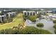 Aerial view showcasing the community, complete with condos, golf course, and waterfront access at 3200 Cove Cay Dr # 5F, Clearwater, FL 33760
