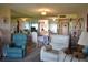 Comfortable living area with mirrored wall and view into adjacent kitchen area at 3200 Cove Cay Dr # 5F, Clearwater, FL 33760