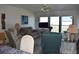 Inviting living room featuring comfortable seating and large windows for natural light at 3200 Cove Cay Dr # 5F, Clearwater, FL 33760