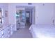 Bright bedroom with a dressing table and a view of the community at 3200 Cove Cay Dr # 5F, Clearwater, FL 33760